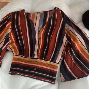 Cropped blouse with flowing sleeves